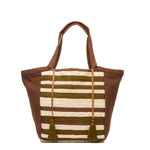Front of the hand woven artisan Rosa Tote in Forest pattern. The Forest pattern has beige and olive green horizontal stripes with triangular brown finishes and handles. Two tassels with a leather cord are on the front.