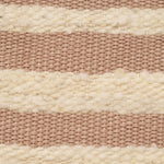 Hand woven artisan Estella Tote in Snow pattern. The photo is a close up shot of the bag. It shows the warp and weft of the fabric in pale pink and beige colors.
