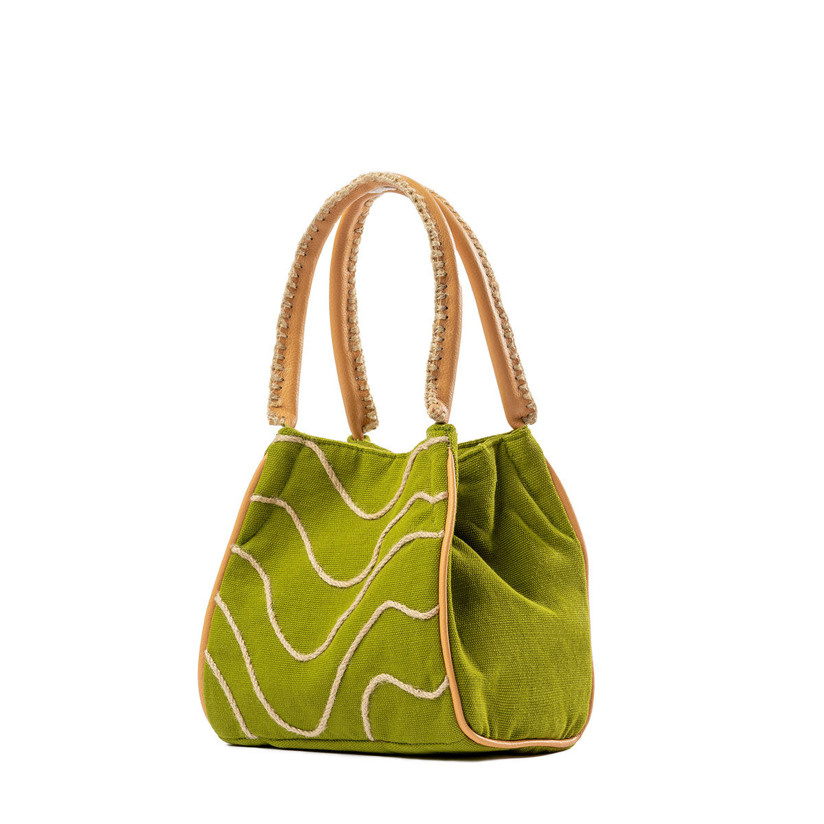 A right-sided angle of the hand woven artisan Flora Petite Crossbody in Turf Moss. The sides have a solid green fabric with a leather vein detailing. It has embroidered detailing on the leather handles. It is shown without the leather crossbody strap.