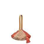 Dulce Wristlet in Desert Sands. The bag has an octagonal shape. It has a leather handle, a coral pink tassel, and leather zipper pull. It has a mixed coral pink and beige pattern with horizontal stripes and alternating dots.