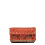 Front view of the Margarita Clutch in Desert Sands. The pattern is coral pink with horizontal beige dots. It has pink fringe. The clutch is folded over.