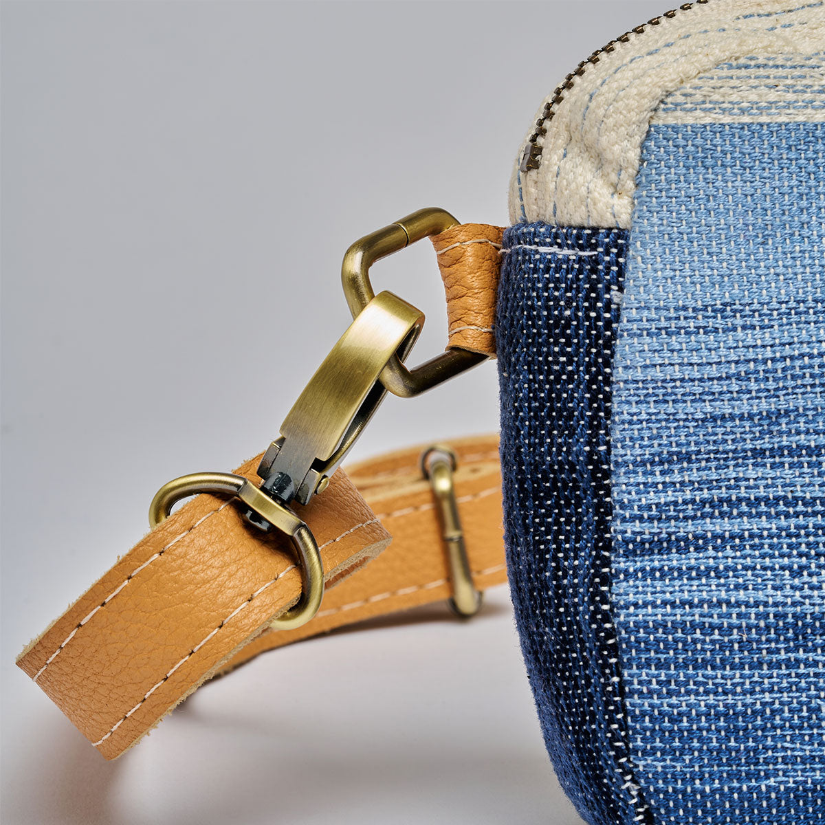 Felipa Belt Bag in Ocean Breeze. A close up of the buckle detail.