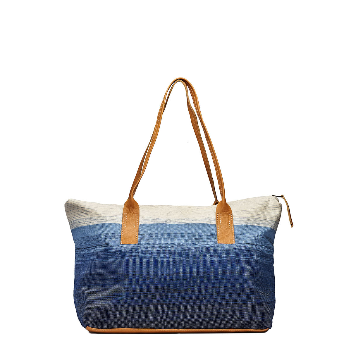 Back view of the Soledad Weekender in Ocean Breeze. It has a white to dark blue gradient. It has leather handles, base, and zipper pull.