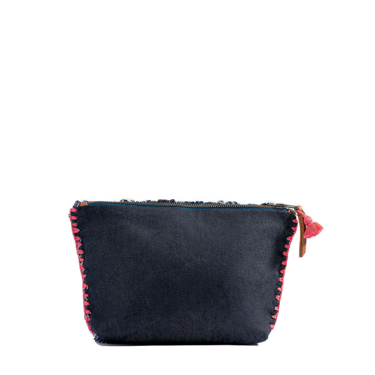 The back of the hand woven artisan Cristina Cosmetic Pouch in Denimology. The back has a single dark wash denim fabric. It is stitched to the front with thick coral pink thread.