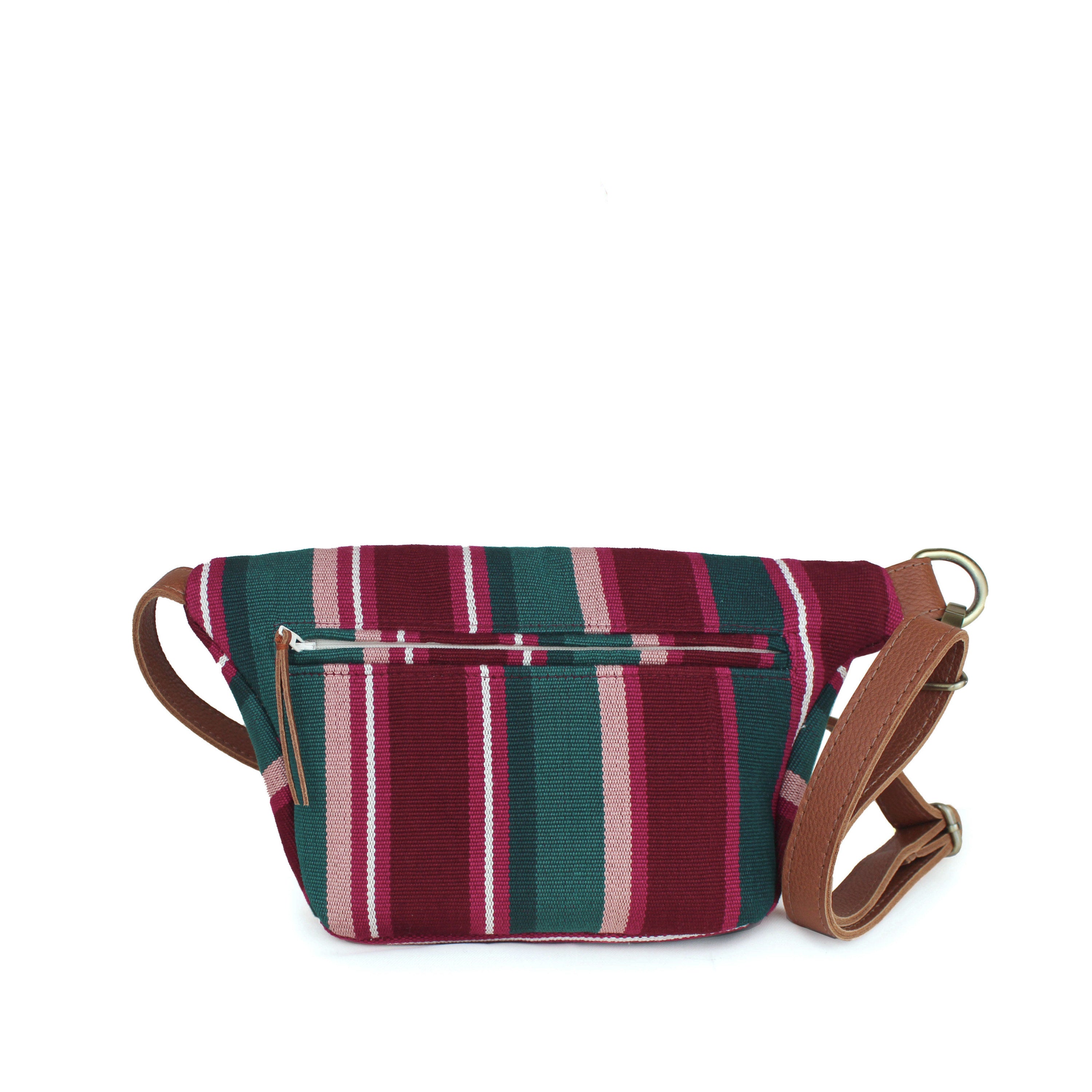 Back view of the hand woven artisan Cruza Sling in Ginger pattern. The back has vertical stripes in maroon, pink, and phthalo green colors. It has a zippered pocket with a leather zipper pull. It has an adjustable waist leather strap.