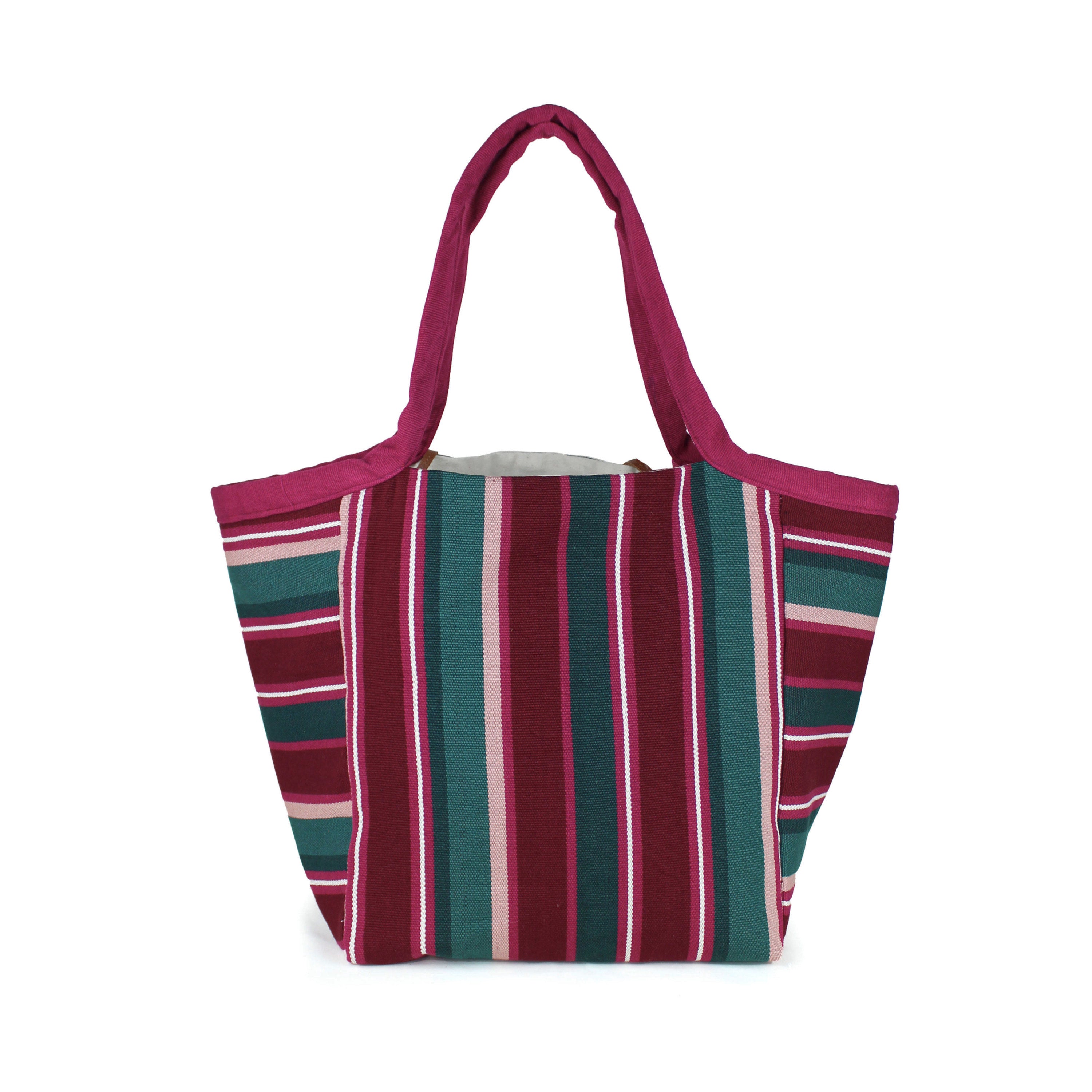 A back view of the hand woven artisan Rosa Tote. It has horizontal and vertical stripes in magenta, maroon, green, and white.