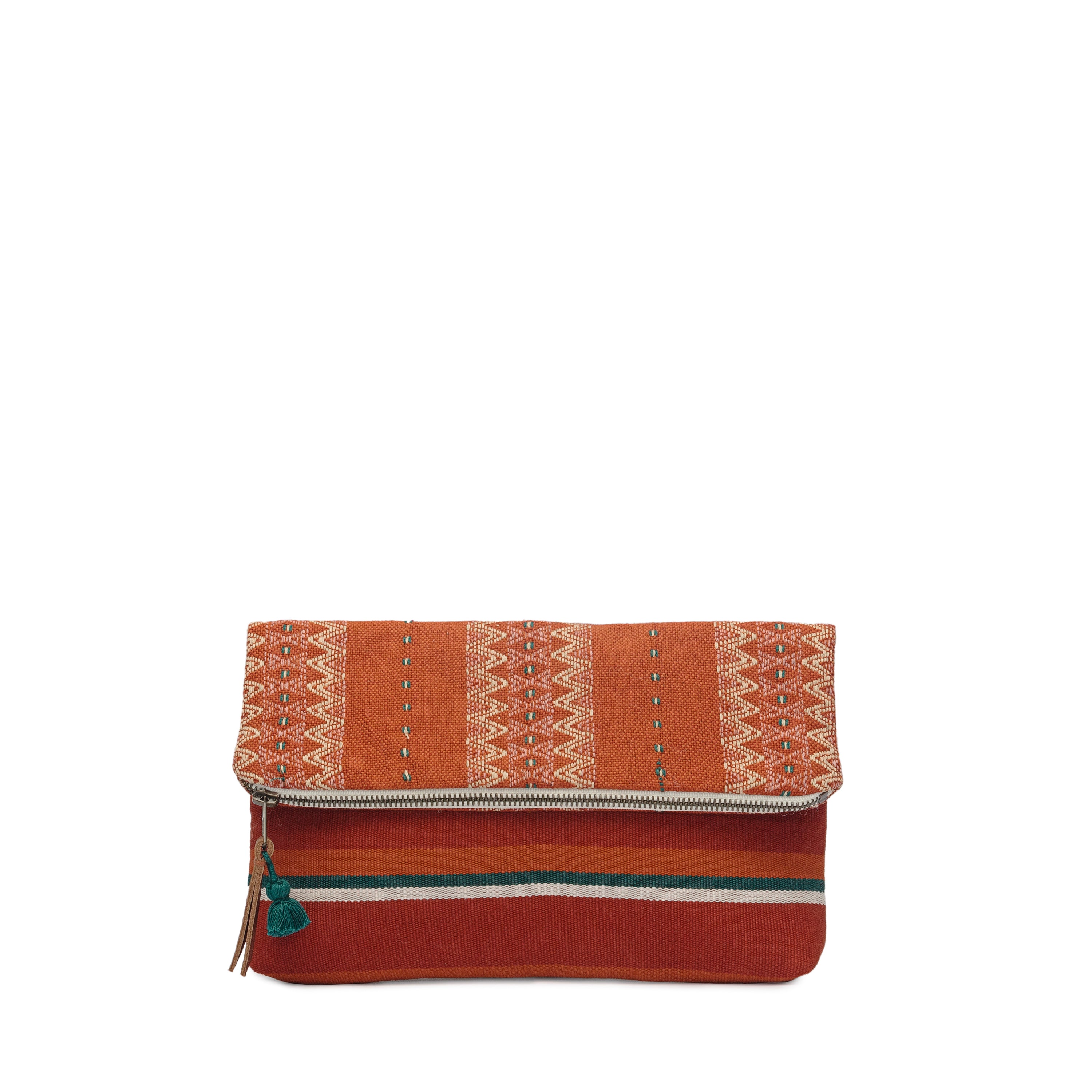 Celia Artisan Handwoven Ginger Clutch. The Clutch has two patterns, one with a red and green vertical striped fabric, and the other with a zigzag yellow and orange pattern. It has a mini green tassel and a leather zipper pull.