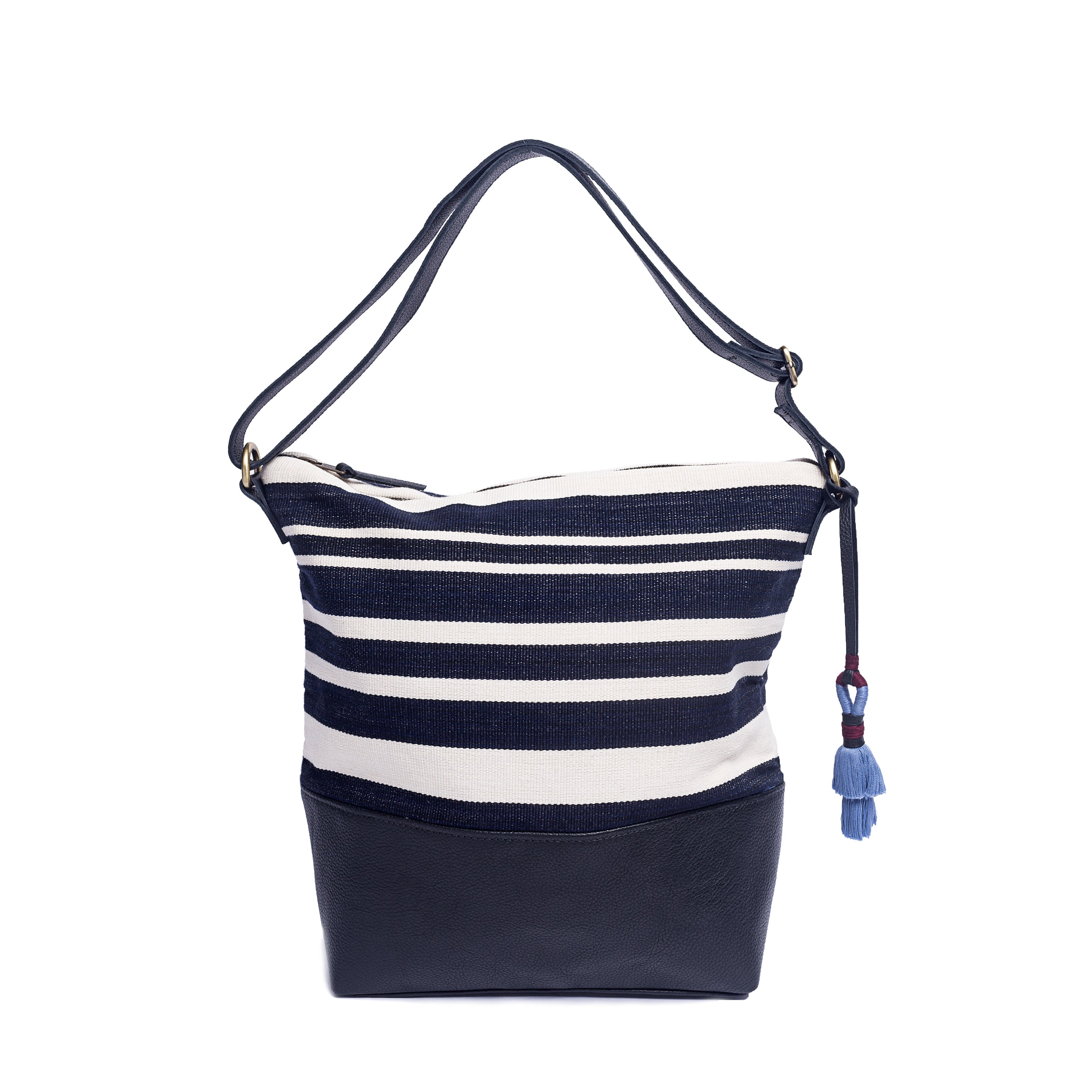 Hand Woven Artisan Lidia Hobo Handwoven Shoulder Bag. The Midnight Black pattern has vertical navy blue and white stripes. It has a navy adjustable leather strap, a leather bottom lining, and a blue tassel.