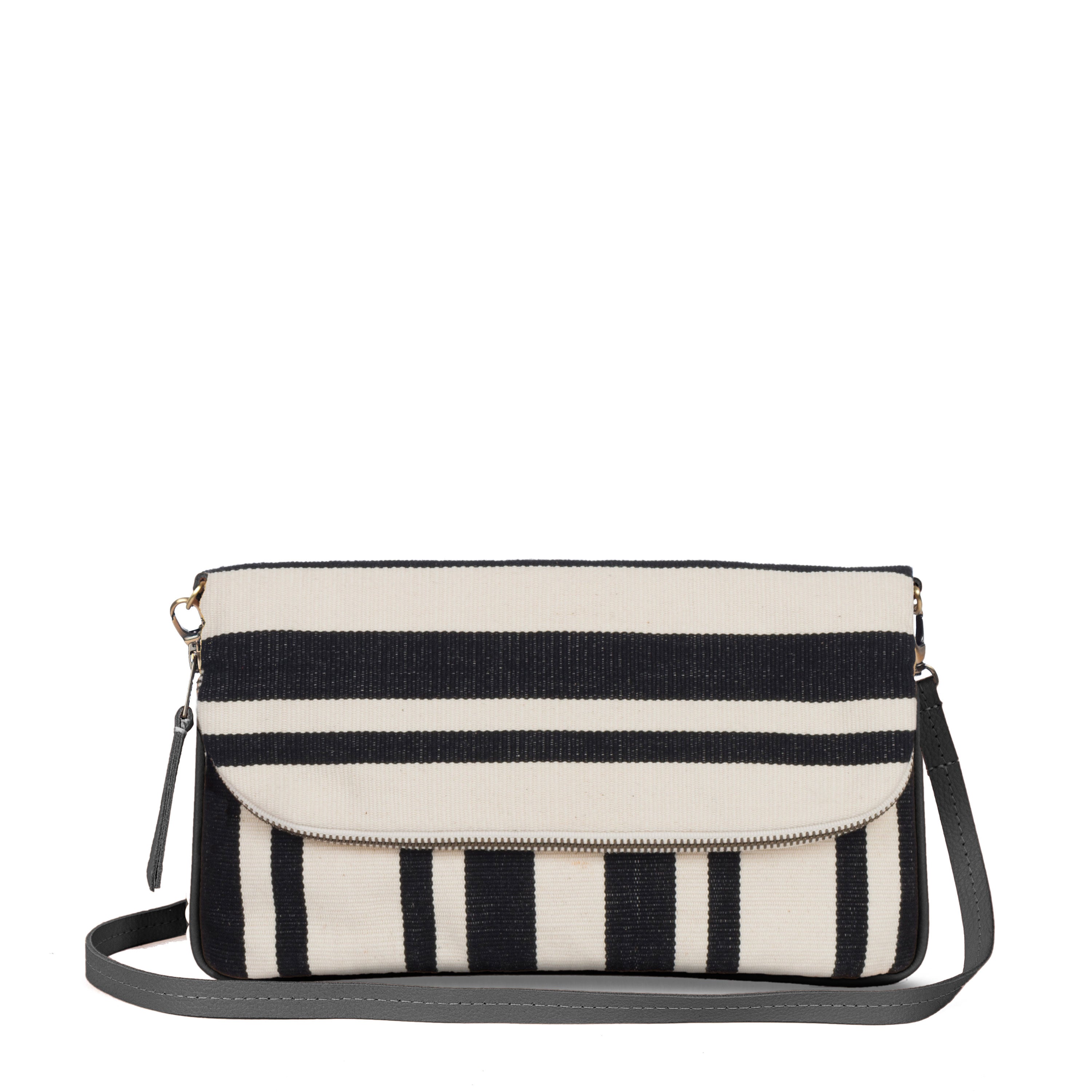 Paulina Artisan Handwoven Crossbody-To-Clutch Black Block Stripe. The pattern has vertical and horizontal black and white stripes. It has a grey detachable leather strap and a mini leather zipper pull.