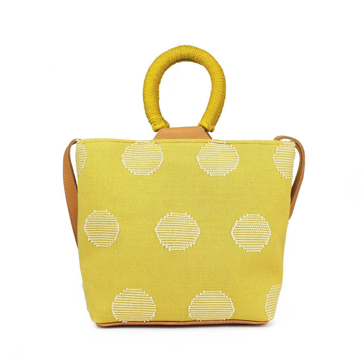 Back of the hand woven artisan Dalila Midi Tote in Sunrise Yellow. The back has the same white circular pattern as the front. It has rounded handles coiled in yellow thread.