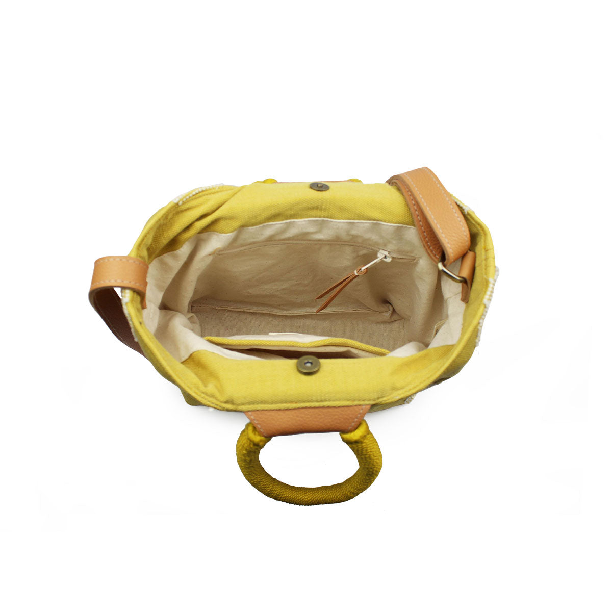 Another top view of the interior of the artisan hand woven Dalila Midi Tote in Sunrise Yellow. The view shows the pocket with a leather zipper pull across from the open pocket. It has a magnetic clasp.