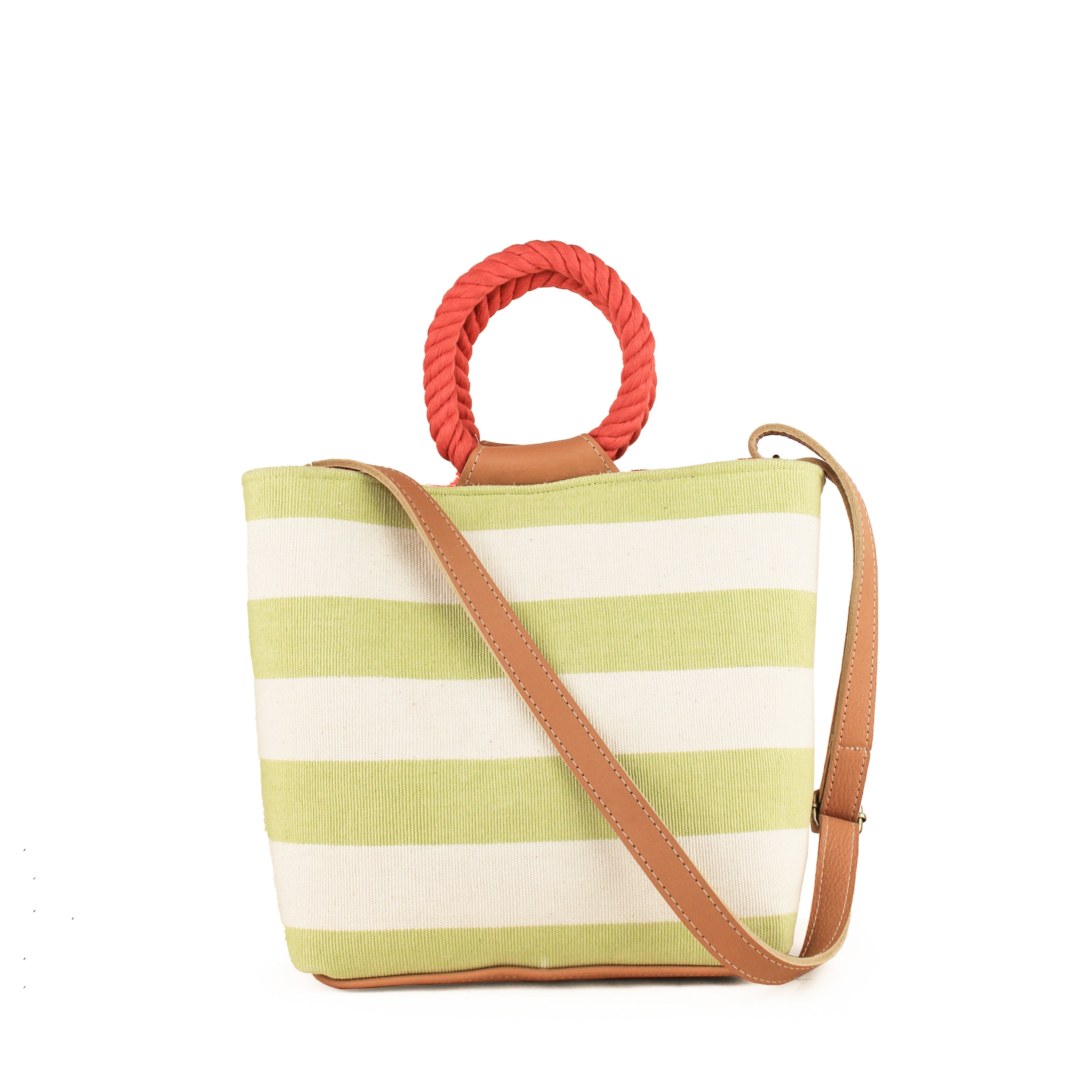 Back of the hand woven artisan Dalila Midi Tote in Heatwaves. The back pattern has thick horizontal pastel green and white stripes. Photo is shown with the leather adjustable strap.