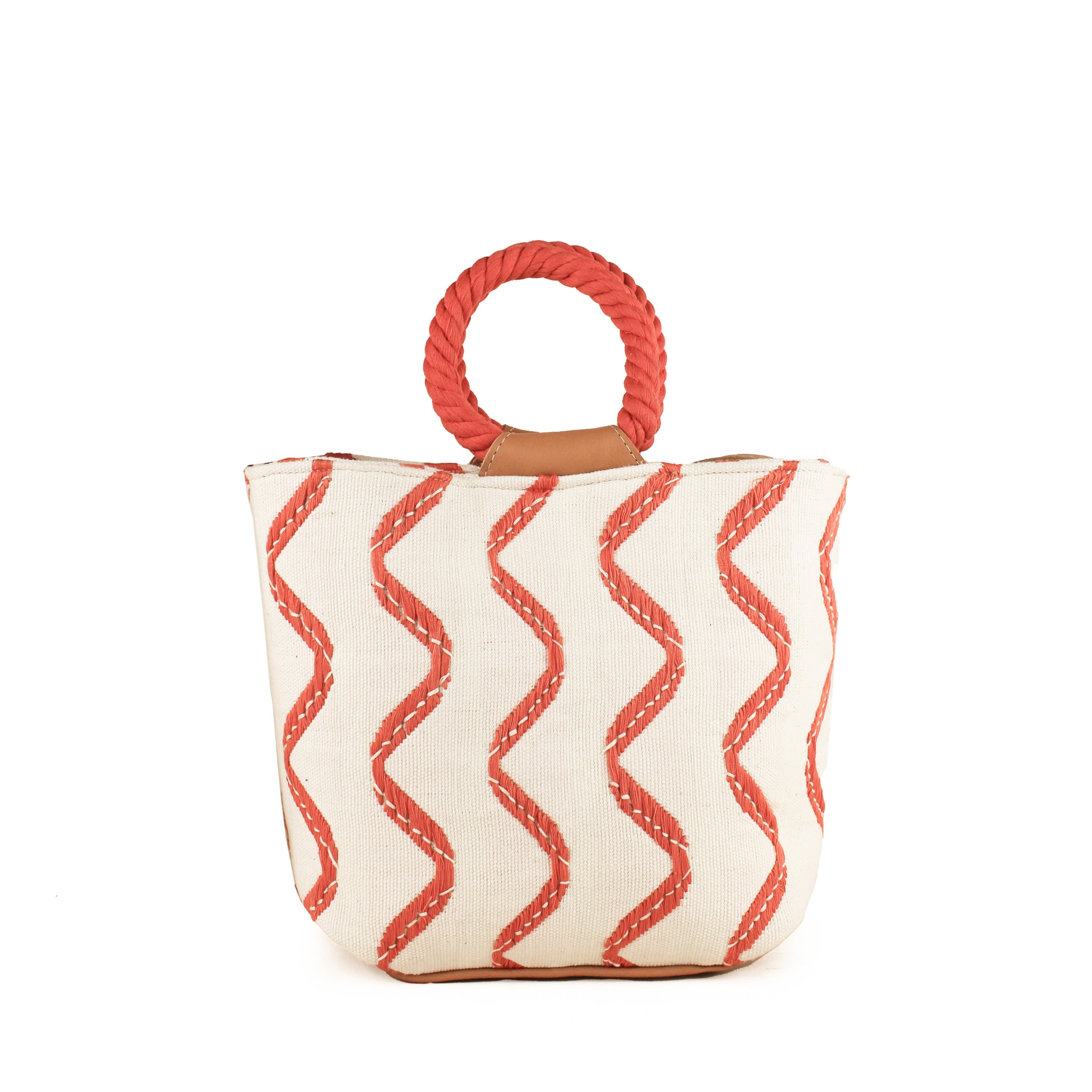 Hand woven artisan Dalila Midi Tote in Heatwaves pattern. The bag has coiled round orange handles. The Heatwaves pattern has vertical wavy orange stripes.