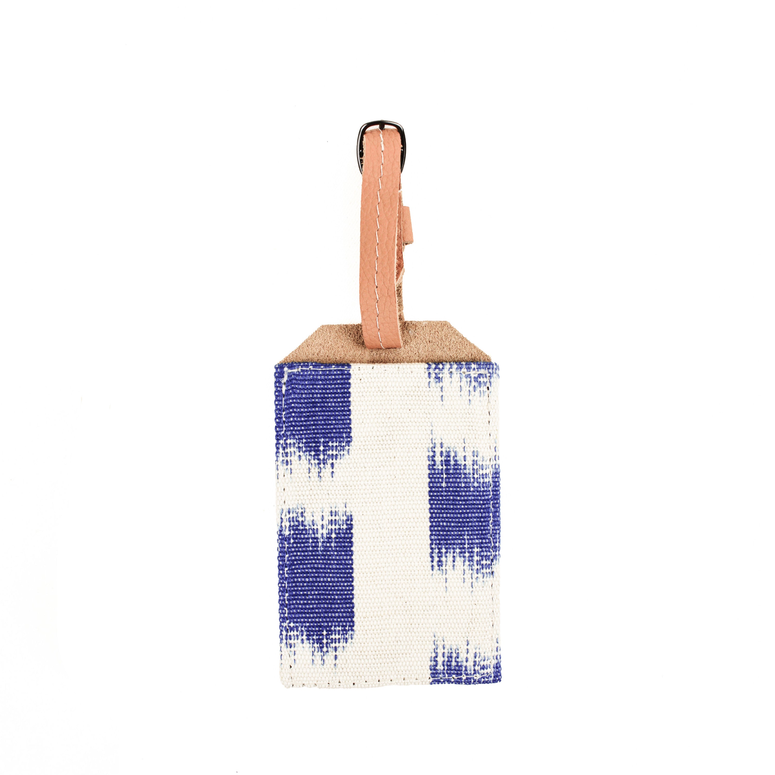 Hand woven artisan Ines Luggage Tag in Brushstrokes. The pattern has flame stitched blue squares over a white background. It has a leather adjustable loop.