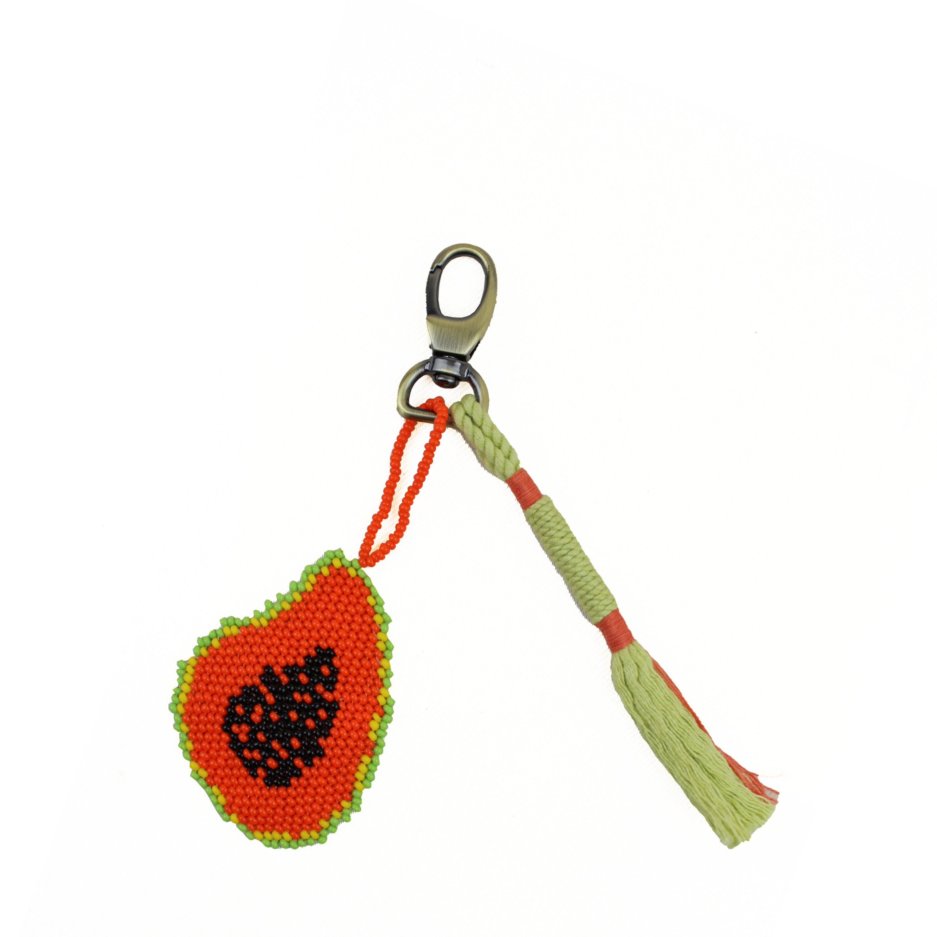 Hand woven artisan Go Bananas Keychain. It has a beaded papaya graphic charm with a woven green and orange tassel attached to a lobster claw clasp.