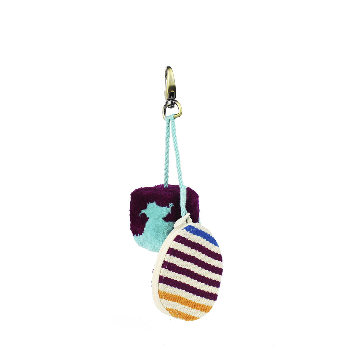 Artisan Handwoven Mercado Key Chain in Moras style. Attached to the clip is a deep purple and mint green pompom and a mini zippered case with yellow, purple, and blue stripes.