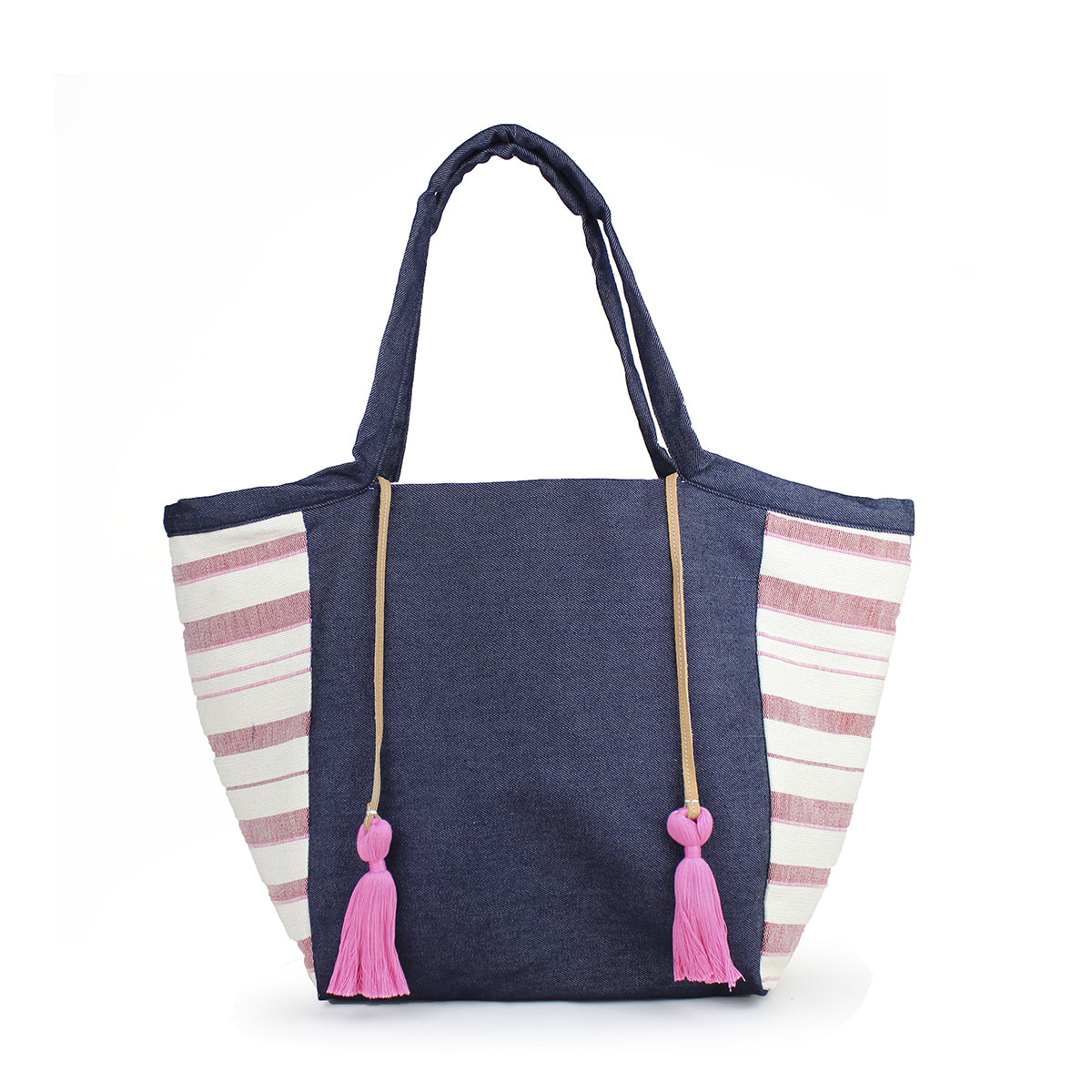 Artisan Rosa Handwoven in Denim Sunset Tote. The tote has a dark wash denim fabric. The sides have a horizontal light red and white striped pattern. It has two pink tassels attached to a leather cord.