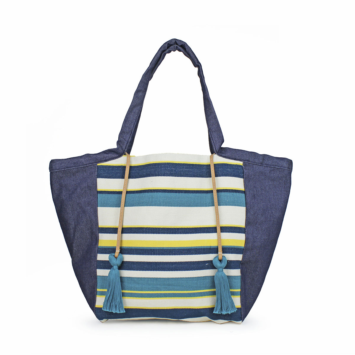 Artisan Rosa Handwoven Tote in Denim Pacific. The bag has a horizontal dark blue, turquoise, lemon yellow, and white striped pattern. It has dark wash denim sides. It has two turquoise tassels attached to leather cords.