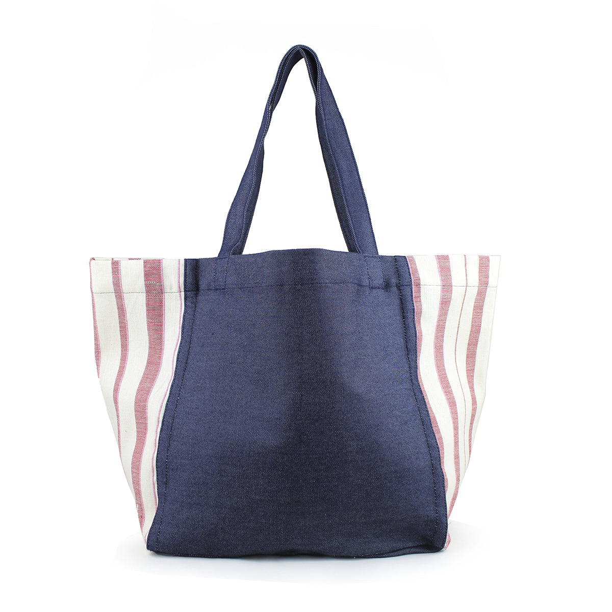 Blanca Handwoven Tote in Denim Sunset Pattern. The Tote has a dark wash denim center and handles. The sides have a triangle finish in a light red and white vertical striped fabric.