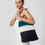 A model holds the Apolonia Tote in Jungle Dip-Dye.