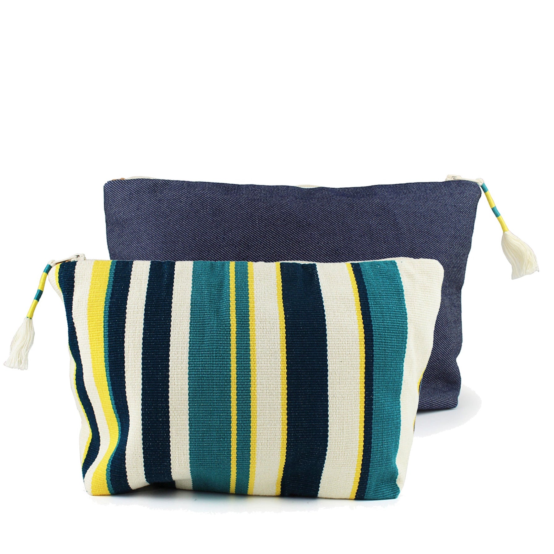 Two hand woven artisan Cristina Pouches in Denim Pacific are together that show the front and back patterns of the bag. The front pattern has vertical dark blue, turquoise, lemon yellow, and beige stripes. The back has a dark wash denim fabric. It has a tassel with wrap around yellow and turquoise thread.