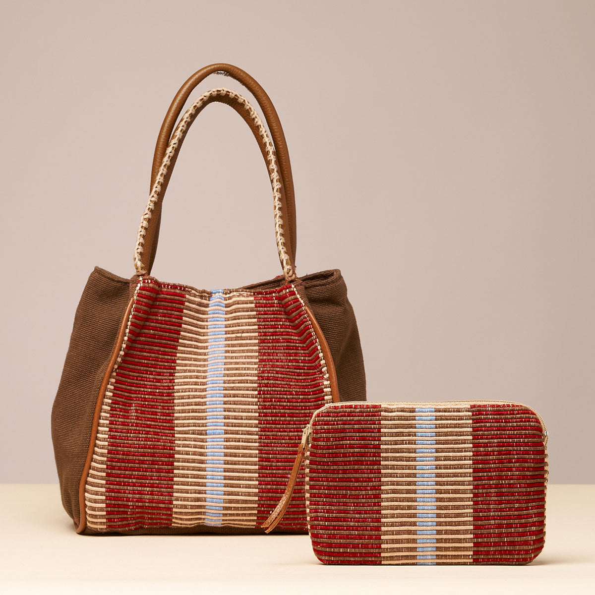 Hand woven artisan Teresa Wallet and Flora Petite Tote in Chestnut pattern. The Chestnut pattern has thick brown and tan vertical stripes.