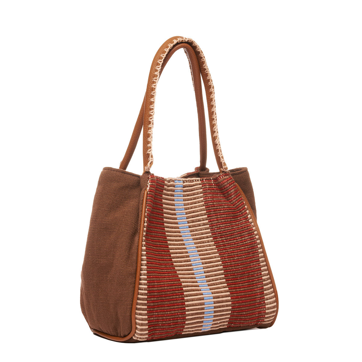 Hand woven artisan Flora Petite Tote in Chestnut shown at an angle. The sides of the bag are in solid brown colors. The leather handles have white embroidered detailing. The Chestnut pattern has thick brown and tan stripes.