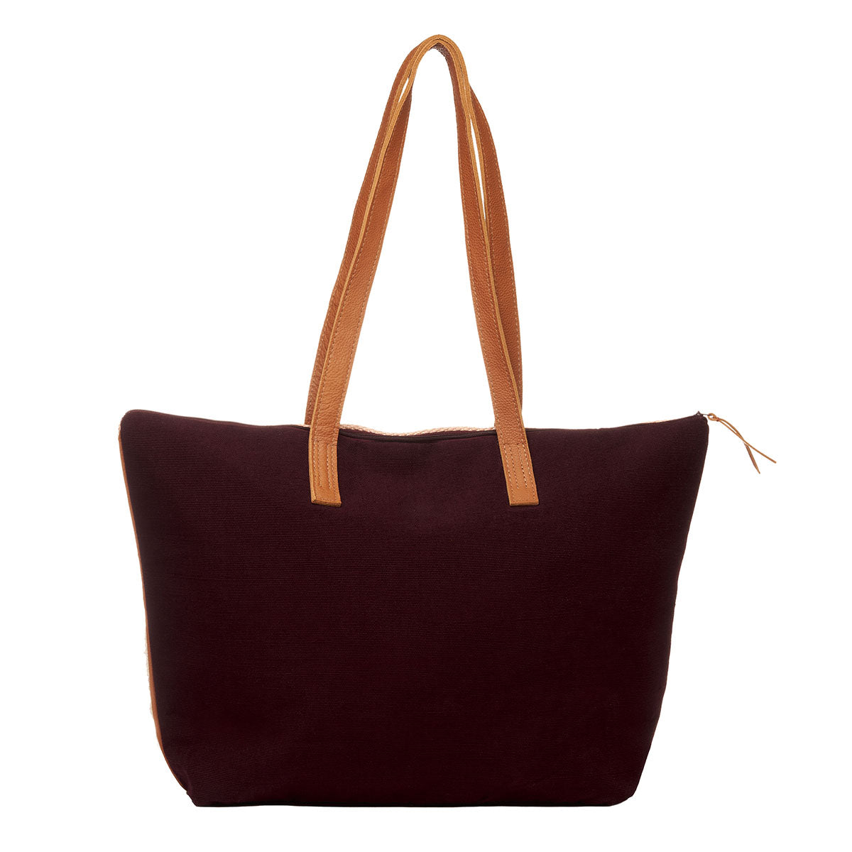 Hand woven artisan Estella Tote in Winter Berry pattern. The back of the bag is shown with a dark brown solid color and leather handles. A small leather zipper is shown to the right.