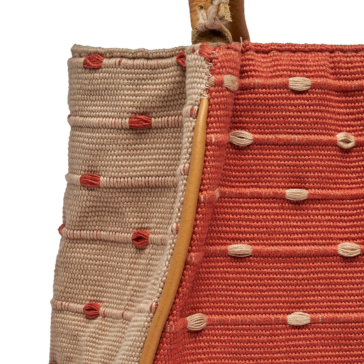 Close up of the leather piping detail of the Flora Petite Tote in Desert Sands.