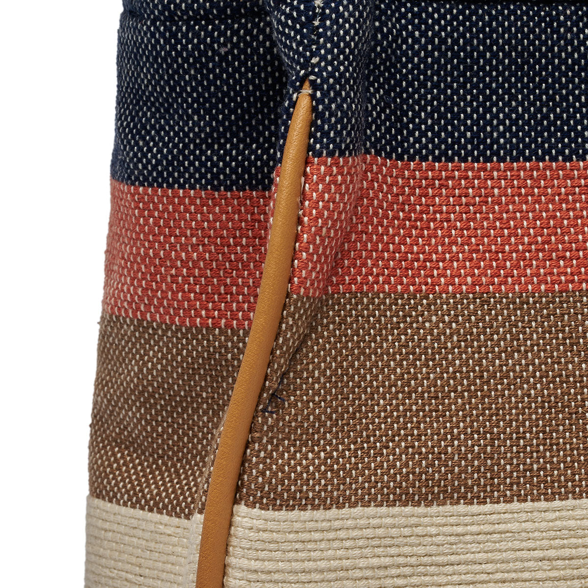 Close up of leather piping detail on the Flora Petite Tote in Blue Canyon.