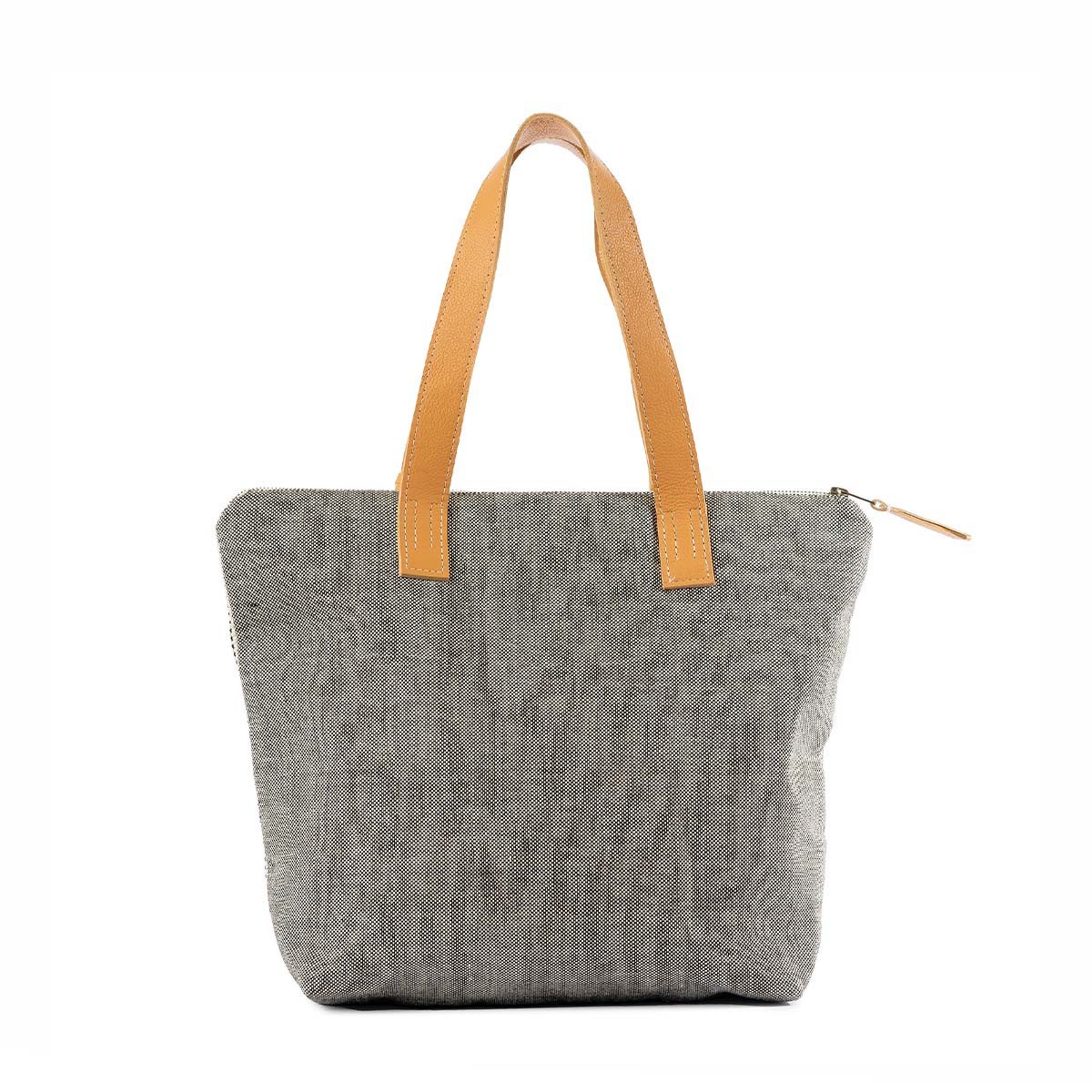 The back of the Angela Tote in Tourmaline color. The back has a solid grey woven color. It has leather handles and a leather zipper pull.