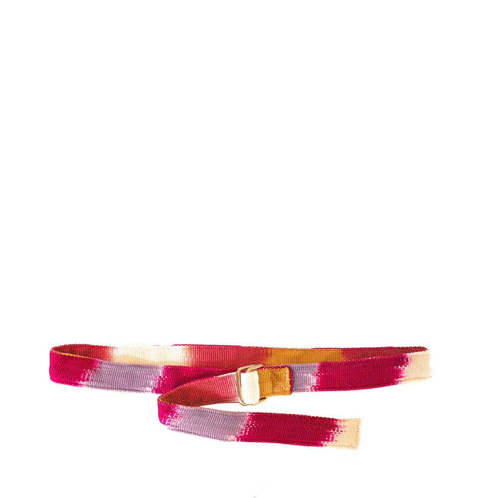 The Celeste Belt in Raspberry Paleta pattern. It has a flame stitch red, purple, yellow ochre, and white pattern.