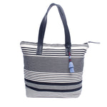 AngelaHandwoven artisan Angela Tote in Black White Stripes. It has leather handles and a light blue tassel.