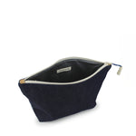 Side top unzipped view of the Cristina Pouch in denim.